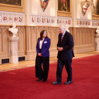 The Duke of Gloucester speaking with Canine Partners CEO, Lucy Eldred, at the Windsor Castle event