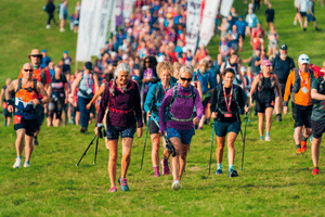An outdoor scene of lots of people on a sponsored hike